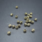 10 kleine Bicone Spacer Perlen 4,5 mm, geriffelt, antik bronzefarben, 10466