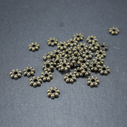 20 Spacer Perlen, Blüten, antik bronzefarben, 10467