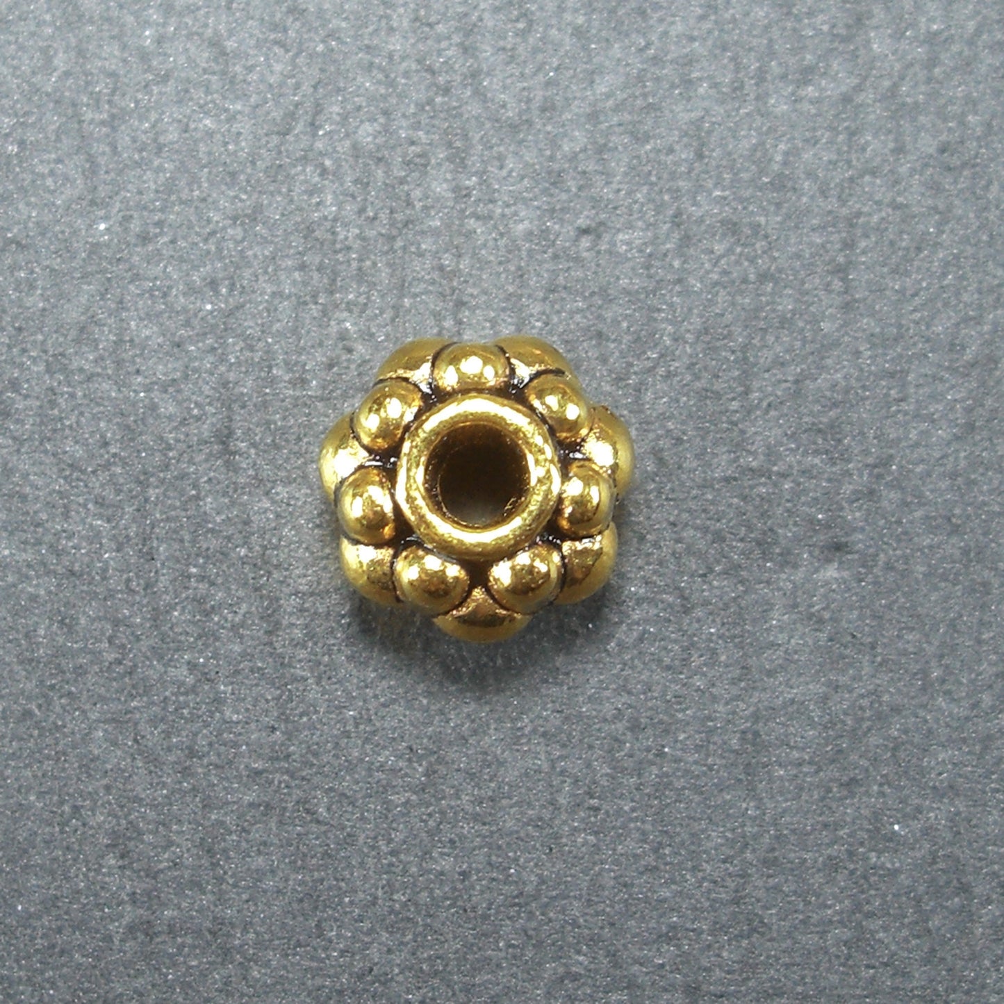 10 Spacer Perlen 7 mm, Blüten, goldfarben, 10465